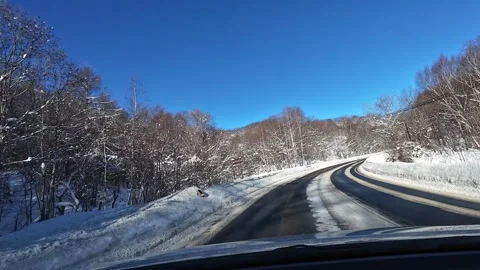 POV Winter Driving Passing a Large Tourist Bus on Snowy Road Hokkaido Japan Video stock 332938987