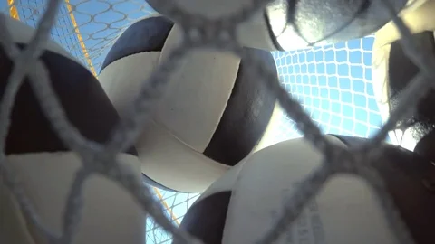 POV of a woman beach volleyball player putting the balls in a bag, slow motion. Stock Footage