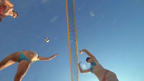 POV of women players playing beach volleyball and a girl hitting the ball. Stock Footage