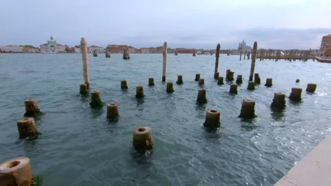 POV - Wooden Posts / structures at pier - Venice, Italy. Tourism / Europe. Stock Footage 132364889