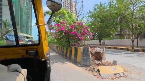 POV Yellow auto rickshaw. A driver navigates through the city traffic Stock Footage 337458377