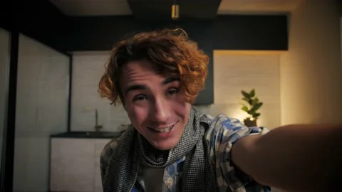 Pov of Young Man make video call using smartphone at home.Guy doing online Stock Footage 221618907