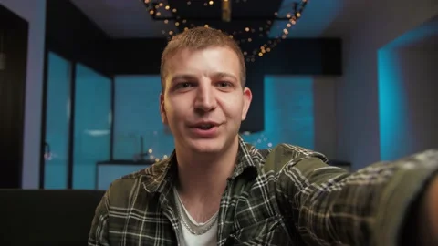 Pov of Young Man make video call using smartphone at home. Guy doing online Stock Footage 225657802