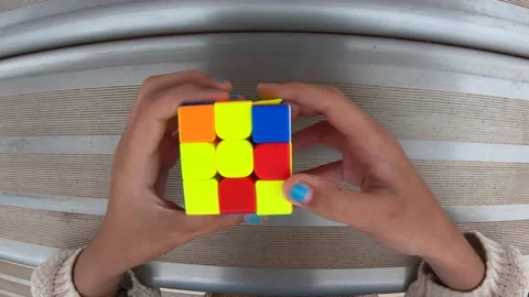 POV young person solving Magic Cube Stock Footage 205539663