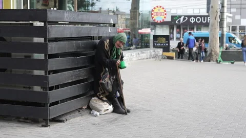 Poverty and Begging on the Streets of Eastern Europe, Moldova. Old woman Stock Footage 312228097