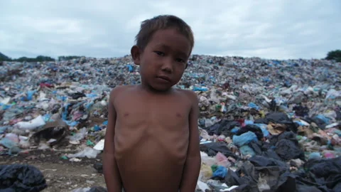 Poverty Boy With Garbage Dump Stock Footage 153714117