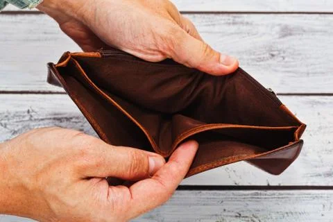 Poverty concept - empty wallet in hands Stock Photos