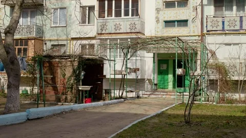 Poverty in post soviet block of flats and shot of entrance in the building. Stock Footage 296389694