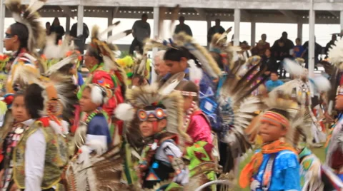 Pow wow grand entry procession and veterans encircling Stock Footage 47786344