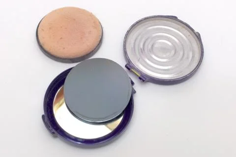 Powder case, broken in half at the loop and disassembled apart Stock Photos