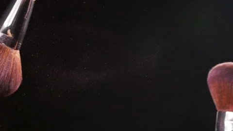 Powder explosion with 2 beauty brushes Stock Footage 89418099
