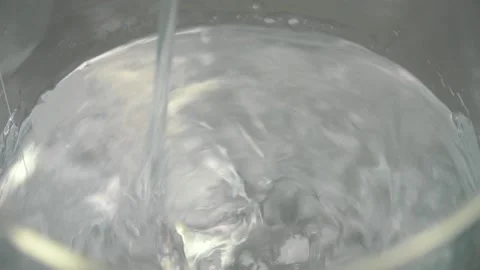 Powder mixing with a liquid and create a white insoluble flakes inside Stock Footage 91326495