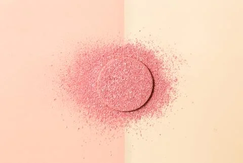 Powdered blush on a sponge on double background of pink and beige Foto stock