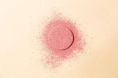 Powdered blush on a sponge on double background of pink and beige Foto stock