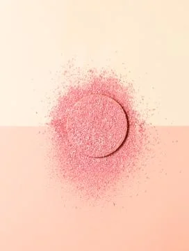 Powdered blush on a sponge on double background of pink and beige Stock Photos
