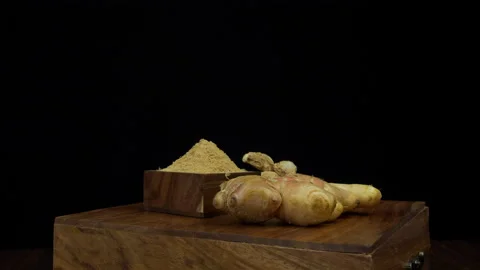 Powdered ginger in a heap, dried ginger, and raw ginger kept together - India... Stock Footage 223497315