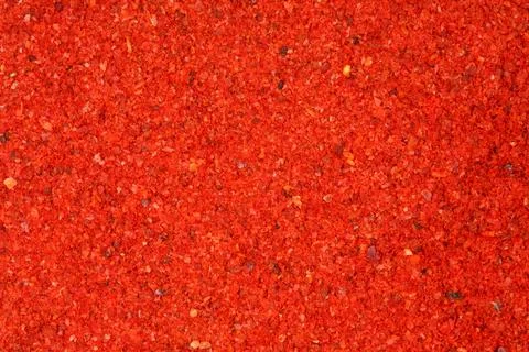 Powdered pimienta roja red pepper close-up. Food background. Stock Photos