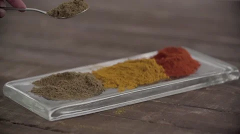 Powdered spice being poured on tray. Stock Footage 54483089