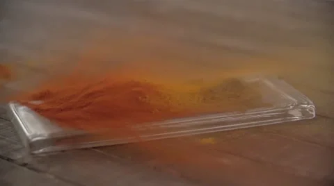 Powdered spice blowing on tray. Stock Footage 54482863