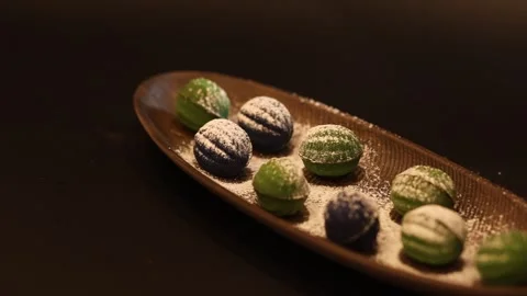 Powdered sugar dusting of shortcrust pastry nuts with filling Stock Footage 334712552