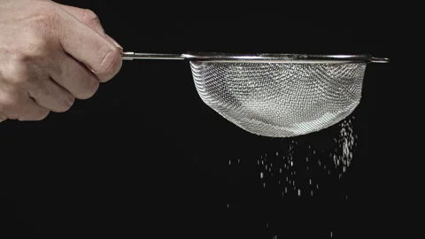 Powdered Sugar falling from Sieve Stock Footage 135653783