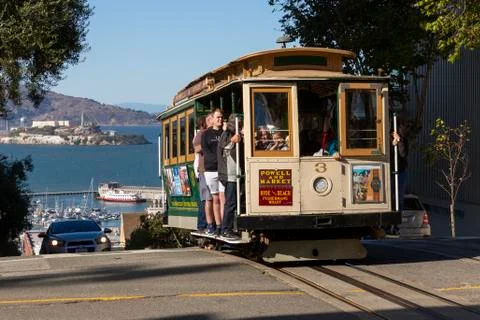 Powell and Hyde Cable Car with Alcatraz in the distance behind Stock Photos