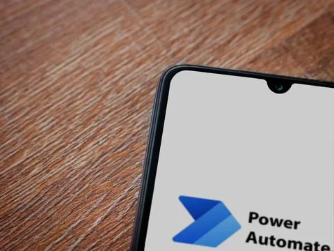 Power Automate app launch screen on smartphone on wooden background Stock Photos