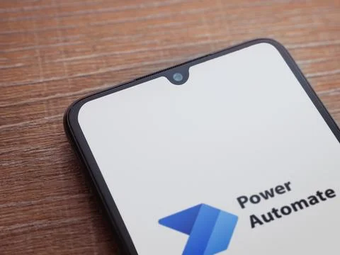 Power Automate app launch screen on smartphone on wooden background Stock Photos