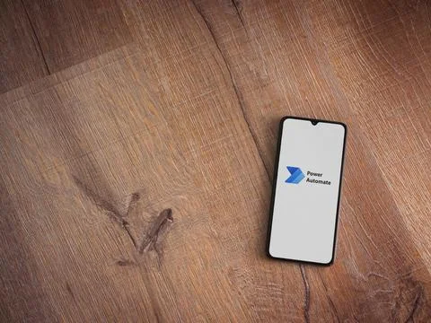 Power Automate app launch screen on smartphone on wooden background Stock Photos