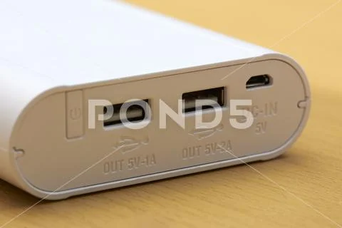 Power bank for charging mobile devices. Stock Photos
