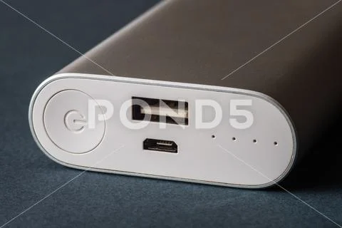 Power bank for charging mobile devices. White smart phone charger with power Stock Photos