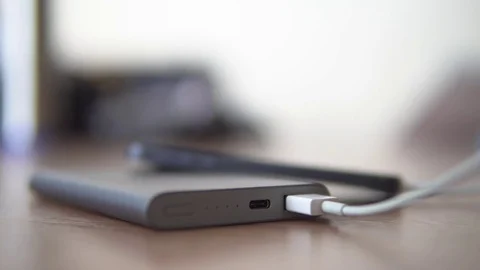 Power bank. Indicators blink while charging Stock Footage 72238214