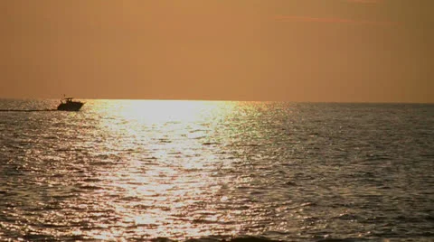 Power boat at sunset Stock Footage 24832568