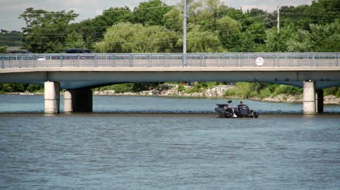Power boat under bridge Stock Footage 25950581