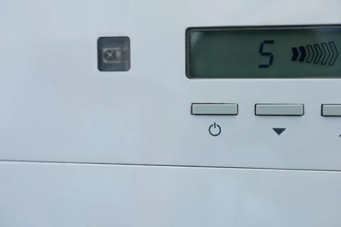 The power button on the air purifier, close-up. Stock Photos