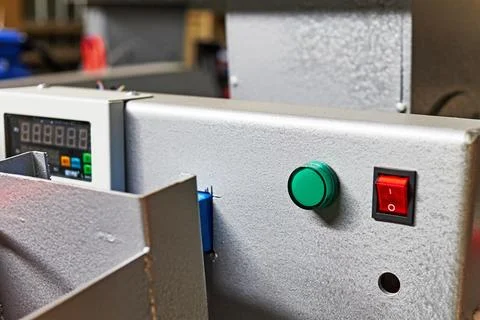 The power button and indicator light on the control panel of the equipment Stock Photos
