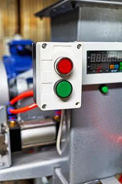 The power button and indicator light on the control panel of the equipment Stock Photos
