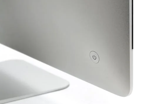 Power button on computer, isolated on a white. Stock Photos