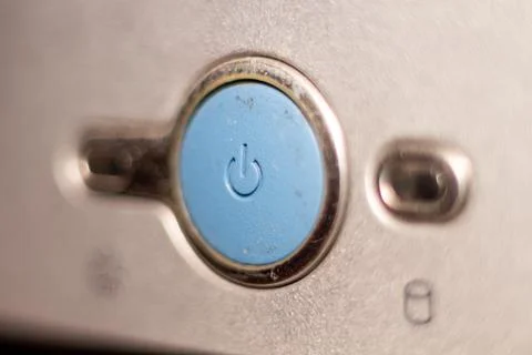 Power button on digital camera device silver metallic surface macro detail 写真素材