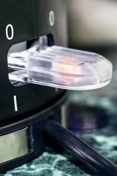 Power button on electric kettle close up Photos