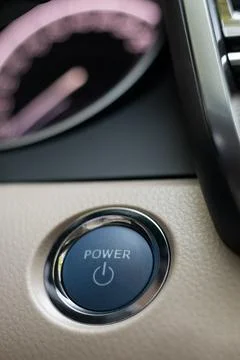 Power button or engine start and stop button in modern car Stock Photos