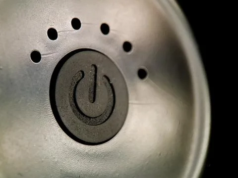Power button signifies activation with dot array on textured surface contra.. Stock Photos