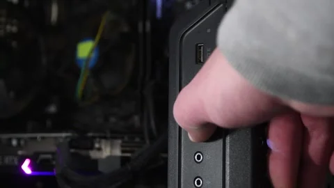 Power button Turning on a desktop computer. close-up Stock Footage 309880171