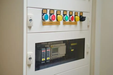The power cable connects to the electrical panel Abb ? Schneider with an auto Stock Photos
