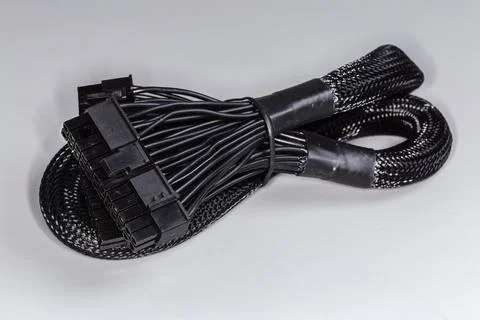 Power cable of modular computer power supply in braided sleeving Stock Photos