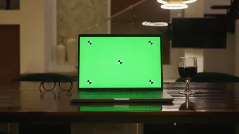 Power of chroma key on laptop on table with green chroma key screen modern Stock Footage 312506688
