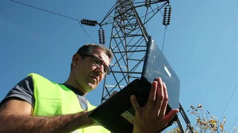 Power Company Worker with Laptop Stock Footage 12538331