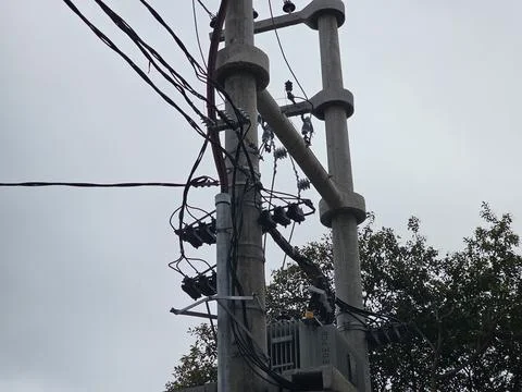 Power distribution infrastructure with utility pole and electrical wiring Stock Photos