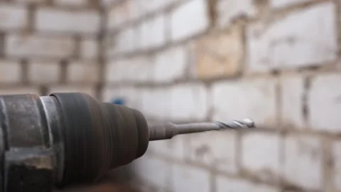 Power drill bit spinning for construction work Stock Footage 330080861