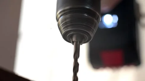 The power drill drilling into the wood and screwing in screws. Closeup Stock Footage 321744384